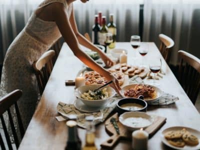 woman-setting-dinner-table